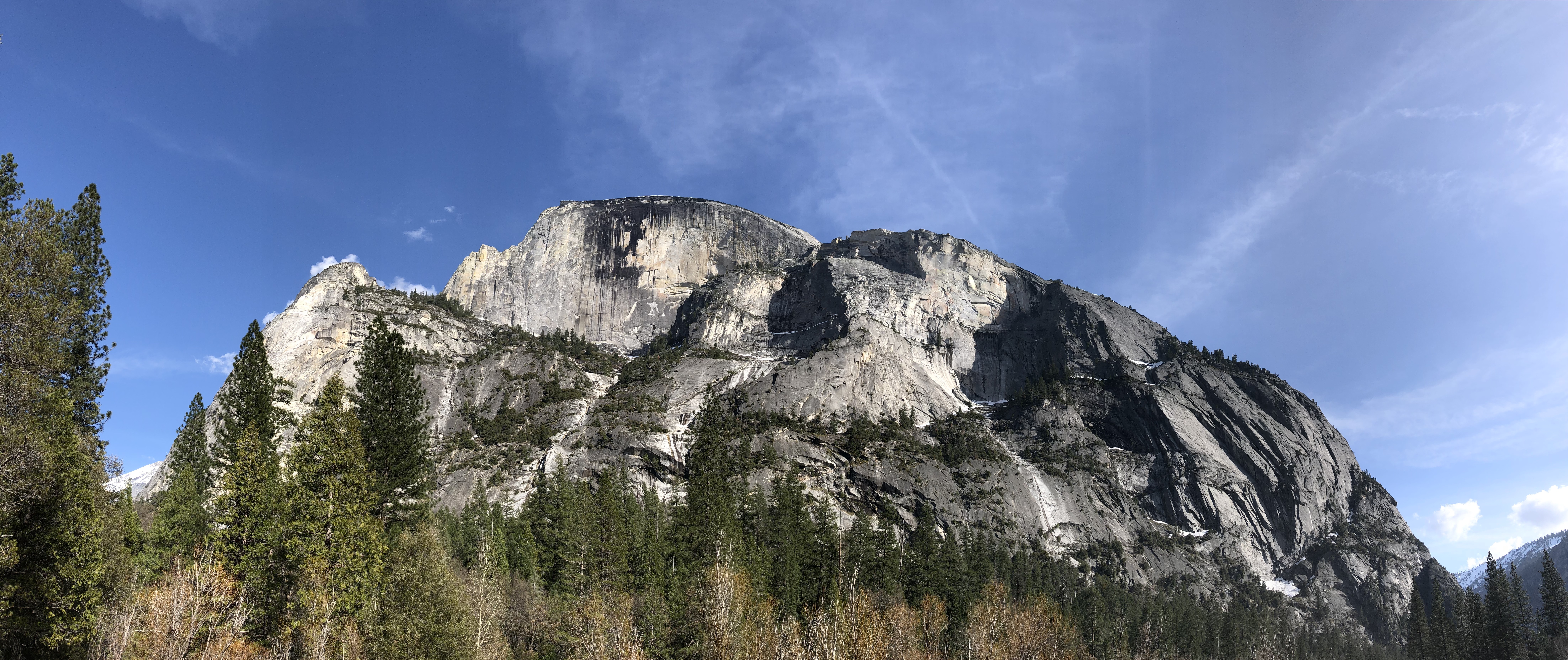 a view of the broad side of Half Dome from Yosemite Valley